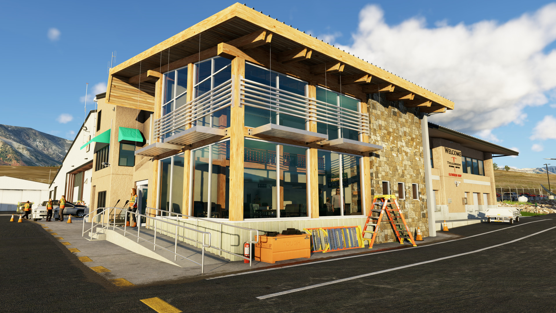 Preview photo of the outside of the terminal expansion at Telluride Regional Airport in X-Plane 12. Building has rich orange wood trim with shiny green glass looking into a warm modern-country interior