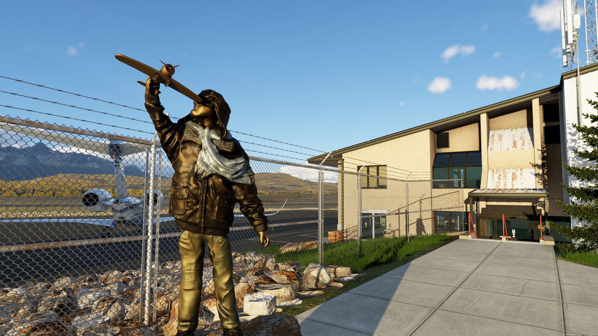 Aviator sculpture in front of terminal enterance at KTEX Telluride Regional Airport in X-Plane 12