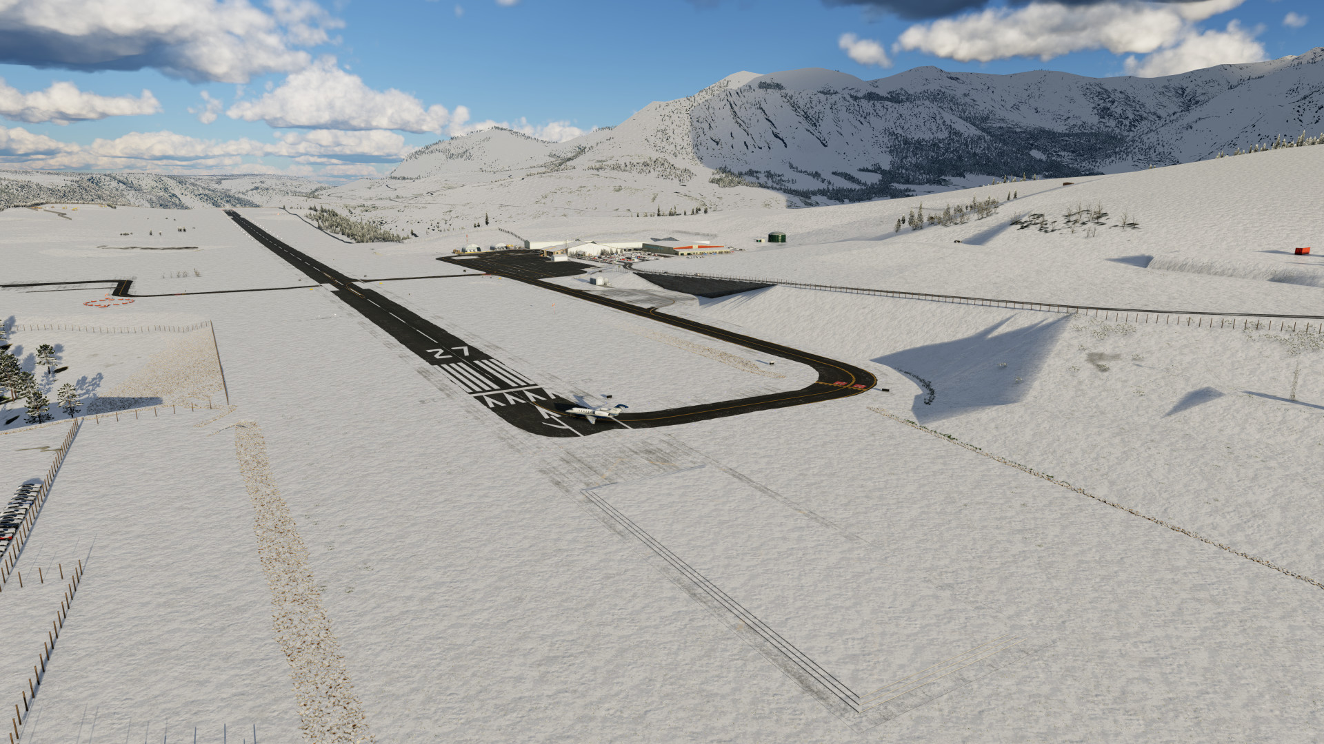 Arial view of runway 9 covered in snow with sharp plow lines at KTEX Telluride Regional Airport in X-Plane 12