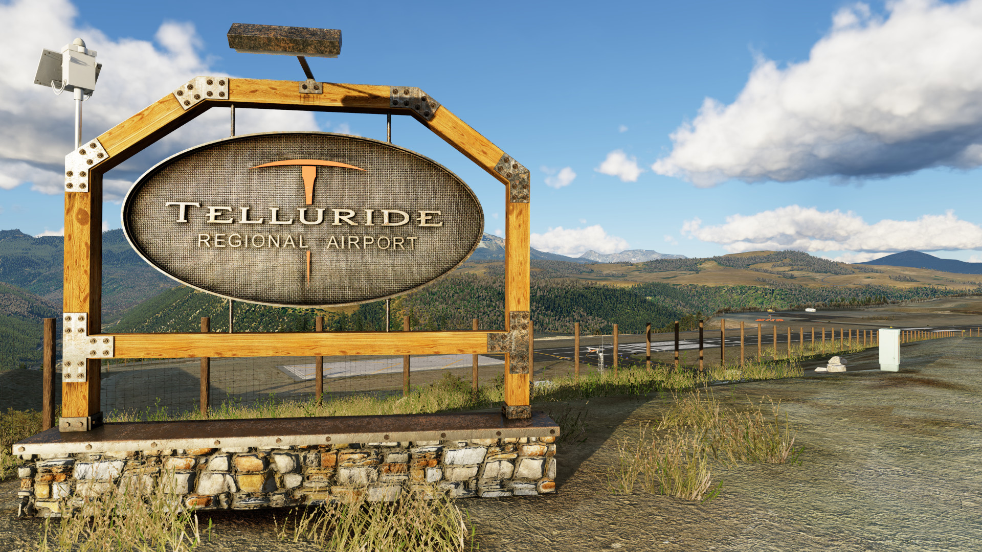 Industrial iron enterance sign with Telluride logo at KTEX Telluride Regional Airport in X-Plane 12